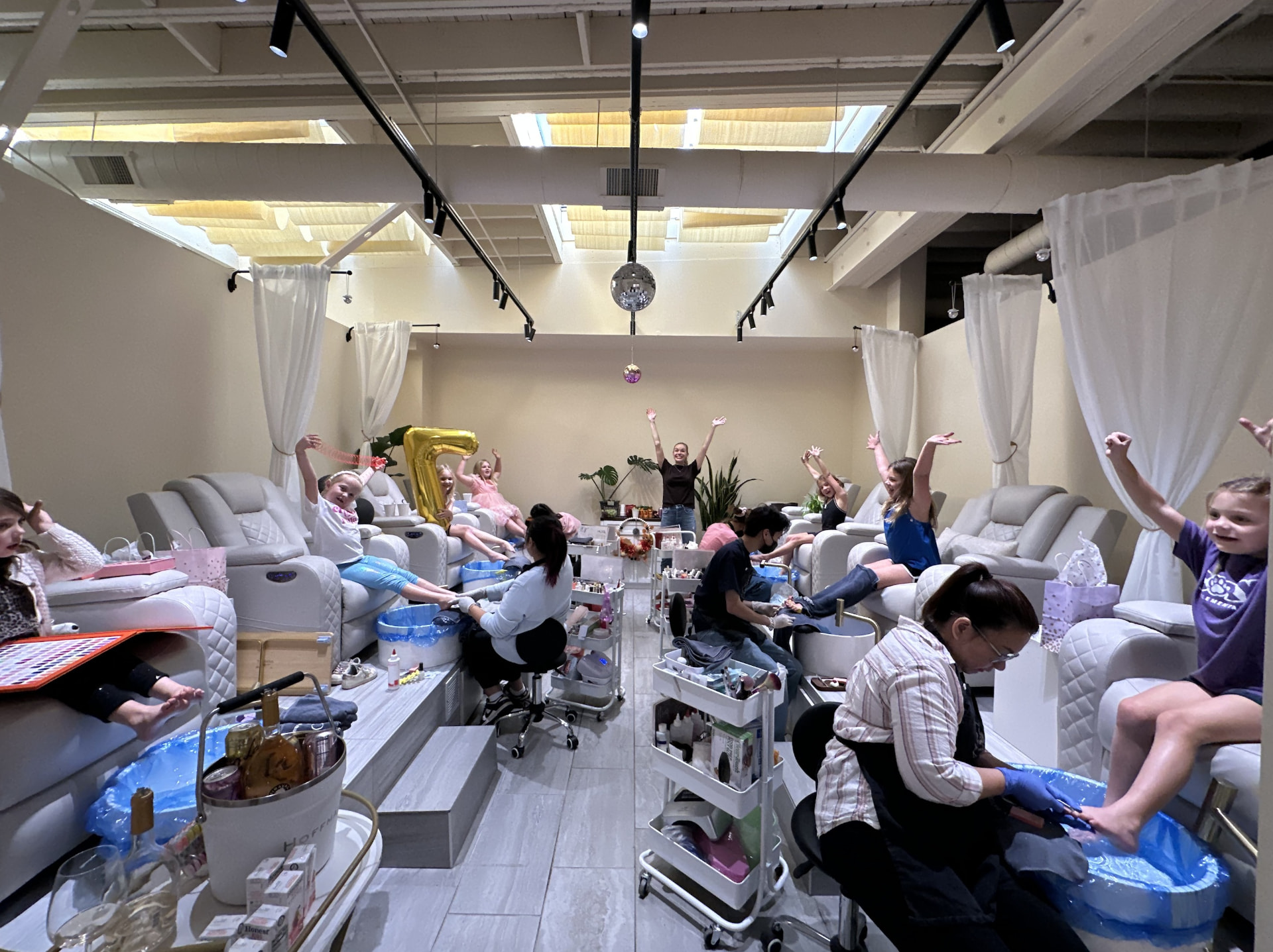 Guests celebrating a birthday party with pedicures at My Favorite Spot Beauty Bar
