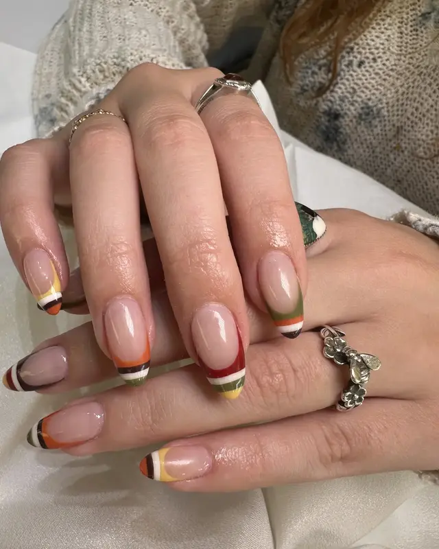 Neutral French manicure with warm color accents