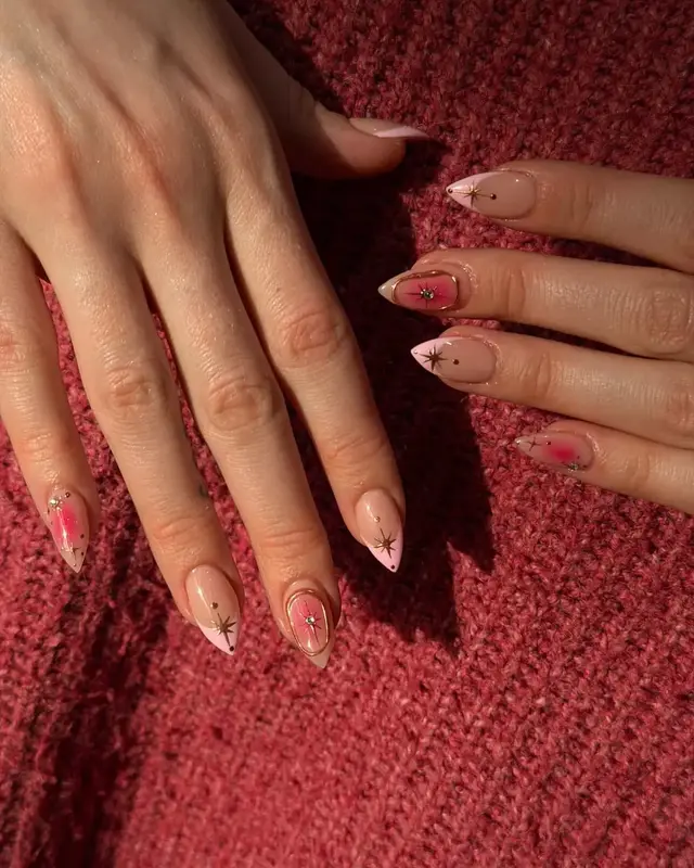 Rose-toned manicure styled with a textured sweater