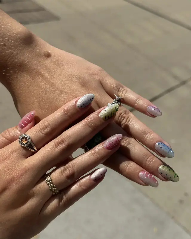 Pastel sculpted nails photographed outdoors