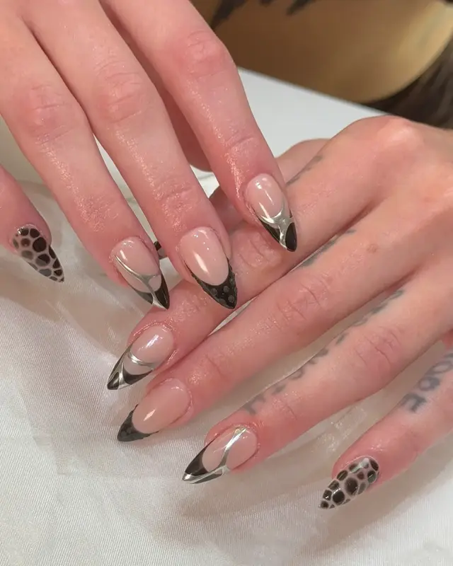 Soft nude manicure with graphic black details
