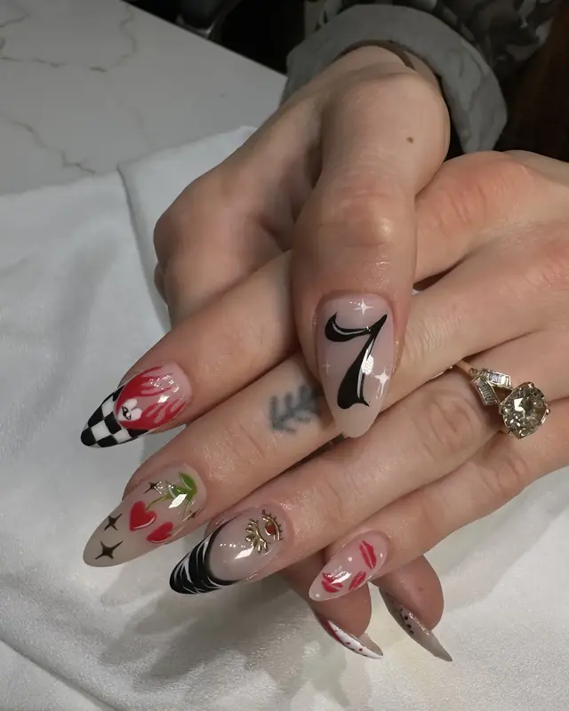 Mixed red, black and illustrated nail art